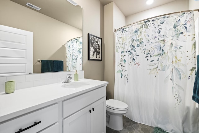 7867 Blanchard Loop, West Richland, WA 99353 - bathroom featuring vanity, tasteful backsplash, recessed lighting, and curtained shower