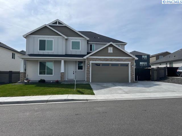 7867 Blanchard Loop, West Richland, WA 99353 - craftsman inspired home featuring driveway, stone siding, and board and batten siding