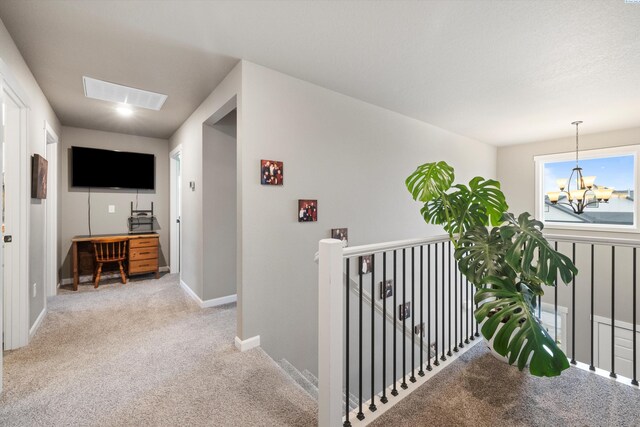7867 Blanchard Loop, West Richland, WA 99353 - hallway with an upstairs landing, a chandelier, and light carpet