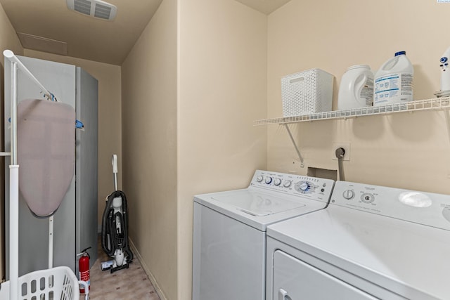 1348 Rohman Dr, Prosser, WA 99350 - clothes washing area with independent washer and dryer, visible vents, laundry area, and baseboards