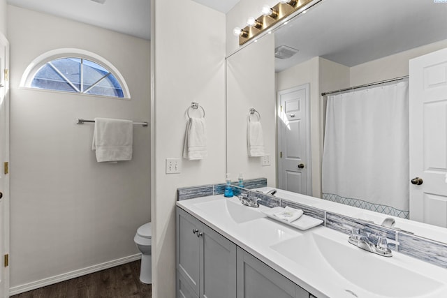 1348 Rohman Dr, Prosser, WA 99350 - full bath featuring visible vents, wood finished floors, toilet, and a sink