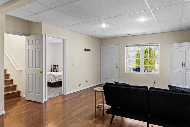 1348 Rohman Dr, Prosser, WA 99350 - living room featuring baseboards, stairway, recessed lighting, dark wood-type flooring, and a paneled ceiling