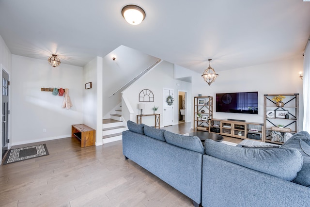 930 SW Finch Way, Pullman, WA 99163 - living area featuring stairway, wood finished floors, and a chandelier