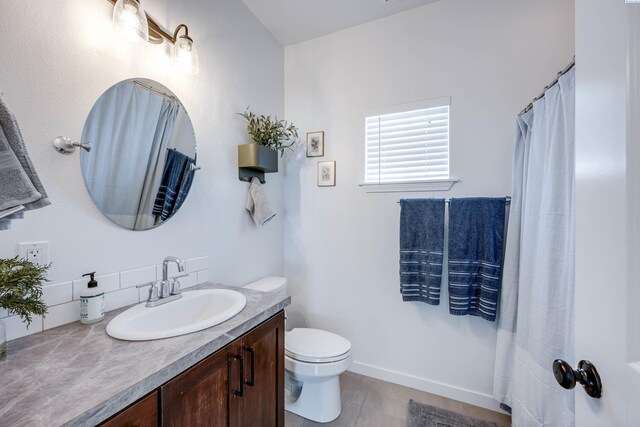 930 SW Finch Way, Pullman, WA 99163 - bathroom with vanity and tasteful backsplash