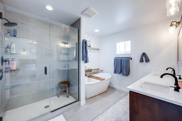 930 SW Finch Way, Pullman, WA 99163 - bathroom with a stall shower, a freestanding tub, double vanity, and recessed lighting