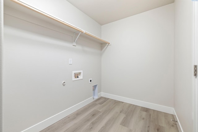 10402 Kokanee Dr, Pasco, WA 99301 - laundry area with washer hookup, electric dryer hookup, light wood-type flooring, laundry area, and baseboards