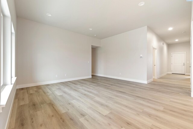 10402 Kokanee Dr, Pasco, WA 99301 - spare room featuring recessed lighting, light wood-style flooring, and baseboards