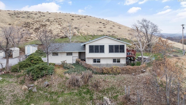 back of property with a mountain view