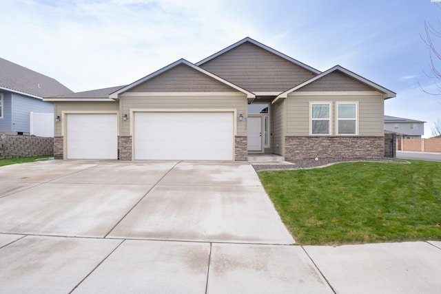 view of front of house featuring a garage and a front lawn