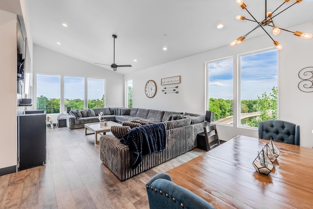 3312 Bing St, West Richland, WA 99353 - living room with a chandelier, healthy amount of natural light, lofted ceiling, wood finished floors, and recessed lighting