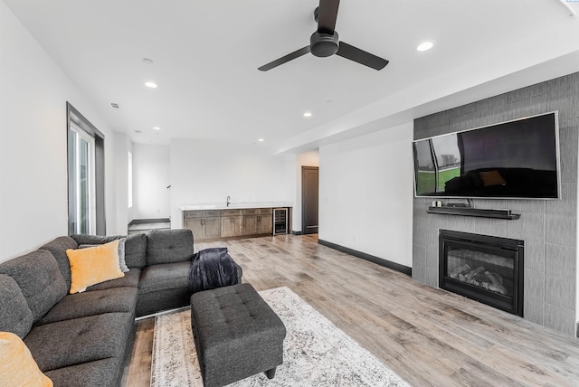 3312 Bing St, West Richland, WA 99353 - living room with recessed lighting, wine cooler, a ceiling fan, light wood-style flooring, and a large fireplace