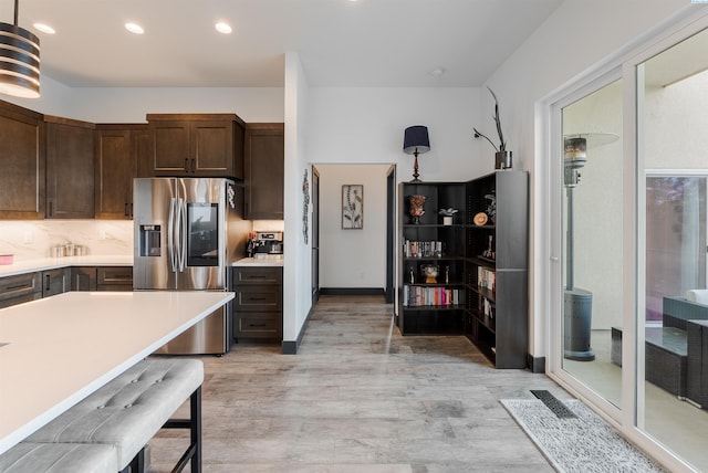 3312 Bing St, West Richland, WA 99353 - kitchen featuring stainless steel fridge, dark brown cabinets, light countertops, recessed lighting, and tasteful backsplash