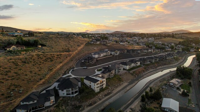 3312 Bing St, West Richland, WA 99353 - aerial view of property's location featuring a mountainous background and nearby suburban area
