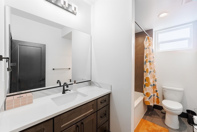 3312 Bing St, West Richland, WA 99353 - bathroom featuring vanity, toilet, shower / bath combination with curtain, and wood finished floors