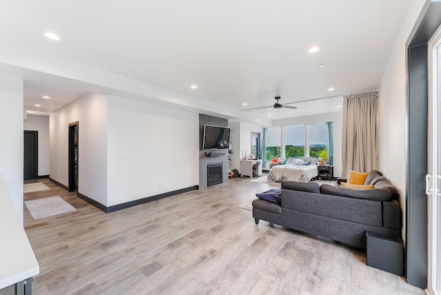 3312 Bing St, West Richland, WA 99353 - living room featuring recessed lighting, a ceiling fan, light wood finished floors, and baseboards