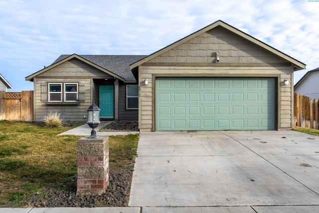 ranch-style home featuring a garage and a front yard