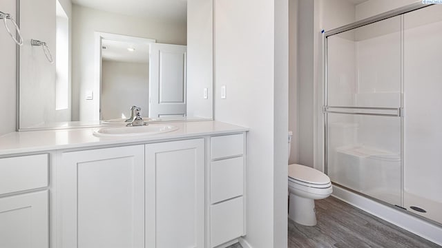 659 S Zeelar St, Kennewick, WA 99336 - bathroom featuring a shower stall, wood finished floors, and vanity