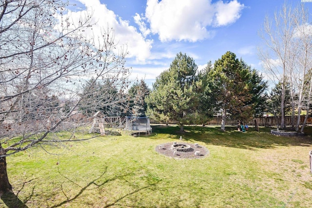 2780 Katie Rd, Kennewick, WA 99338 - view of yard with an outdoor fire pit and a trampoline