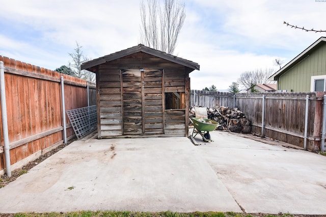 view of shed with a fenced backyard