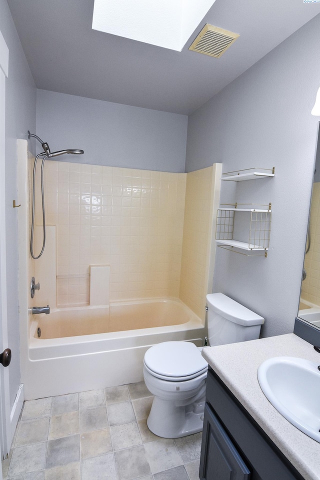 full bathroom with visible vents, toilet, vanity, shower / bathtub combination, and a skylight