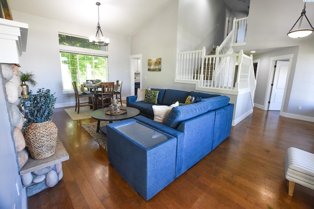 2780 Katie Rd, Kennewick, WA 99338 - living room with high vaulted ceiling, wood-type flooring, stairs, and baseboards