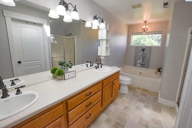 2780 Katie Rd, Kennewick, WA 99338 - full bathroom featuring a chandelier, a stall shower, a garden tub, double vanity, and toilet