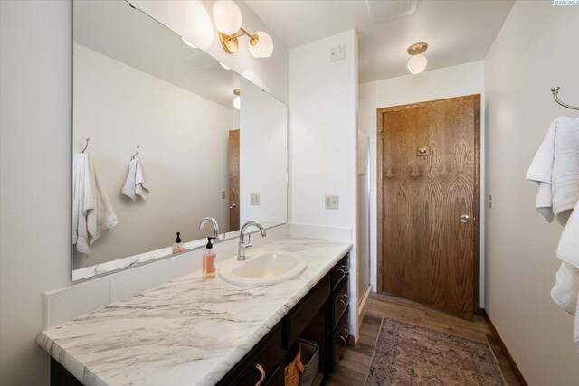 170732 Olsen Rd, Grandview, WA 98930 - full bathroom with wood finished floors and vanity