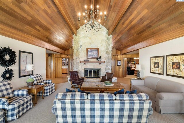 170732 Olsen Rd, Grandview, WA 98930 - carpeted living area featuring a stone fireplace, wood ceiling, and a chandelier