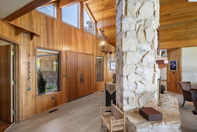 170732 Olsen Rd, Grandview, WA 98930 - living room featuring wood walls, high vaulted ceiling, healthy amount of natural light, and wood finished floors