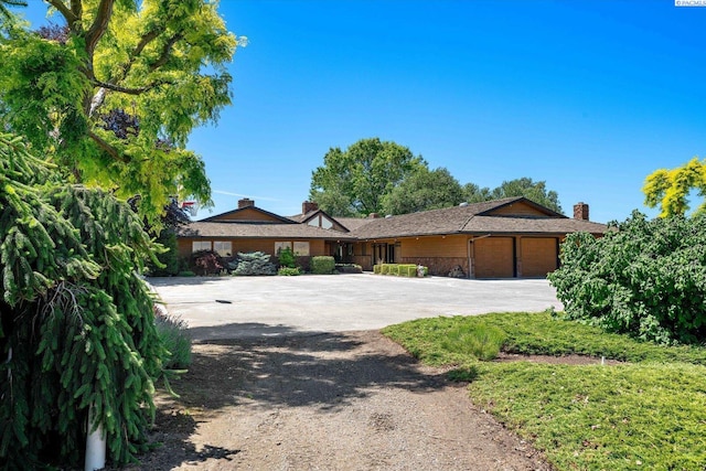 170732 Olsen Rd, Grandview, WA 98930 - ranch-style home featuring concrete driveway and an attached garage