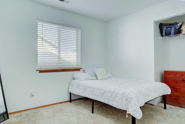 carpeted bedroom with baseboards