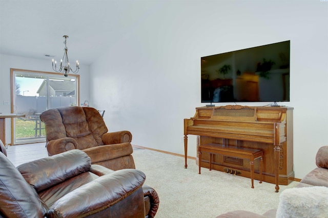 living room with an inviting chandelier, visible vents, baseboards, and carpet flooring