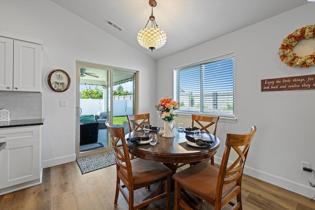 600 Lizzy Ln, Grandview, WA 98930 - dining area with light wood-style floors, lofted ceiling, visible vents, and a wealth of natural light