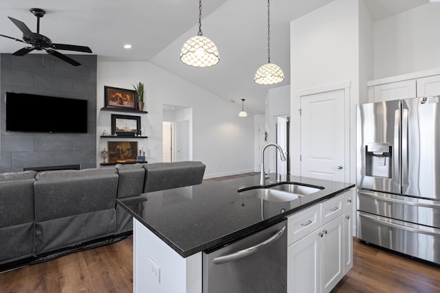 600 Lizzy Ln, Grandview, WA 98930 - kitchen featuring a fireplace, open floor plan, dark wood-style floors, appliances with stainless steel finishes, and a sink