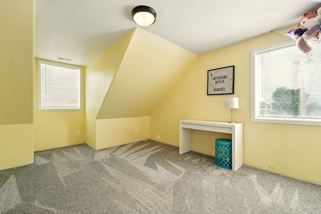 bonus room featuring carpet and lofted ceiling