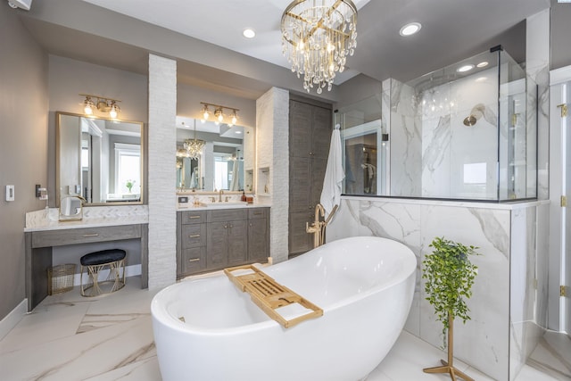 975 Rieve Ct, Richland, WA 99352 - bathroom with a freestanding tub, a marble finish shower, vanity, marble tiled floors, and recessed lighting