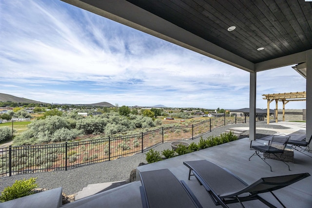 975 Rieve Ct, Richland, WA 99352 - fenced backyard with a pergola, a patio area, and a mountain view