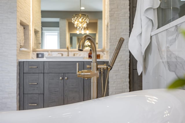 975 Rieve Ct, Richland, WA 99352 - full bath featuring a chandelier and vanity