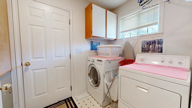 470 NW Robert St, Pullman, WA 99163 - laundry area featuring cabinet space, washing machine and clothes dryer, and light flooring