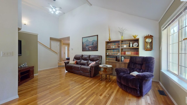 470 NW Robert St, Pullman, WA 99163 - living room with light wood-type flooring, stairs, a ceiling fan, and high vaulted ceiling