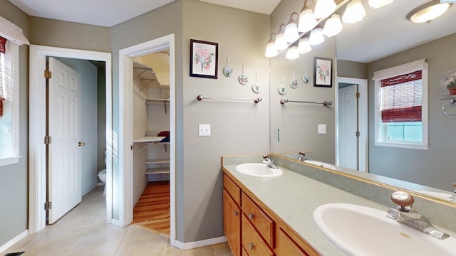 470 NW Robert St, Pullman, WA 99163 - full bathroom featuring double vanity, tile patterned floors, and a walk in closet