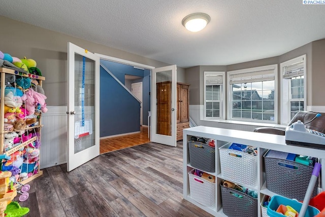 5309 Buchanan Ln, Pasco, WA 99301 - office space with french doors, wainscoting, wood finished floors, and a textured ceiling
