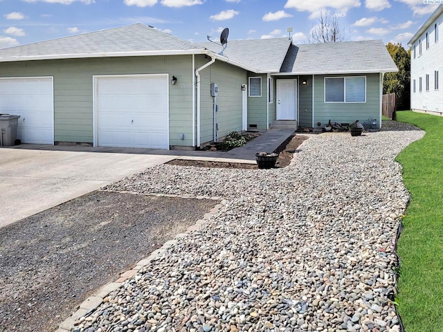 ranch-style house featuring a garage