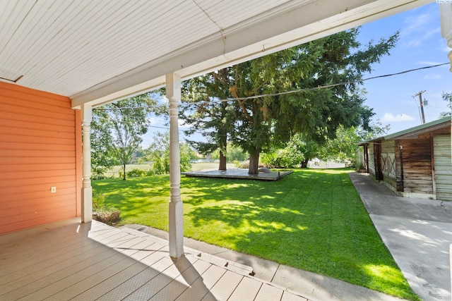 1002 Sherman Ave, Prosser, WA 99350 - wooden deck featuring a lawn and a patio