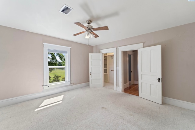 1002 Sherman Ave, Prosser, WA 99350 - unfurnished bedroom with carpet, a ceiling fan, and a spacious closet