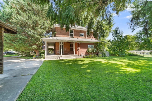 1002 Sherman Ave, Prosser, WA 99350 - view of front of house featuring a porch, a front lawn, and concrete driveway