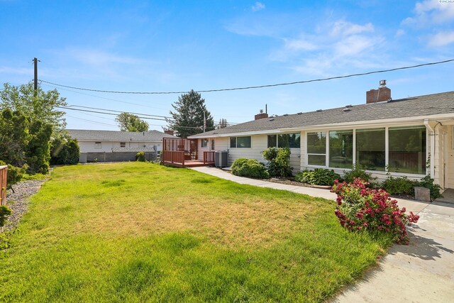 2214 W Clearwater Ave, Kennewick, WA 99336 - view of yard featuring a wooden deck and cooling unit