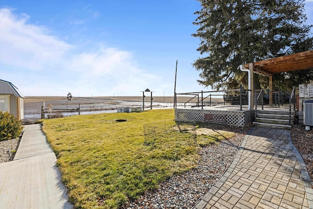 view of yard with a wooden deck and a pergola