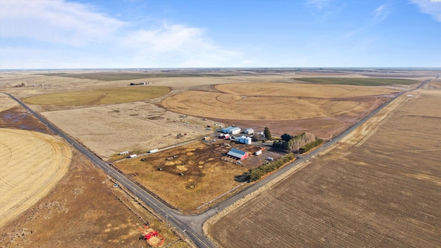 birds eye view of property with a rural view