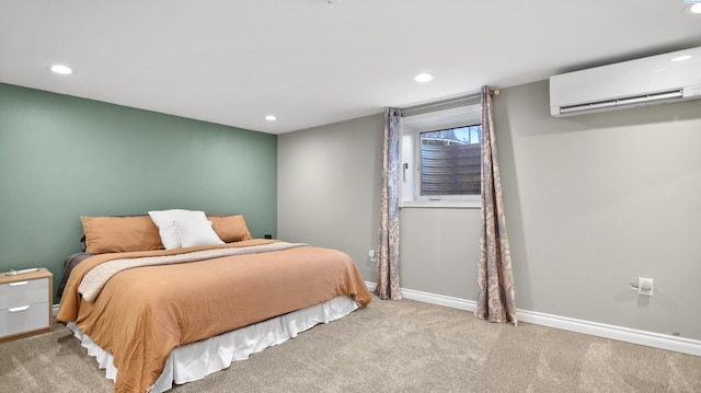 bedroom with light colored carpet, a wall unit AC, baseboards, and recessed lighting